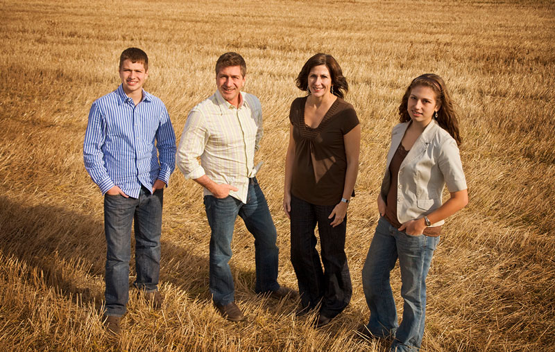 family-in-wheat-field